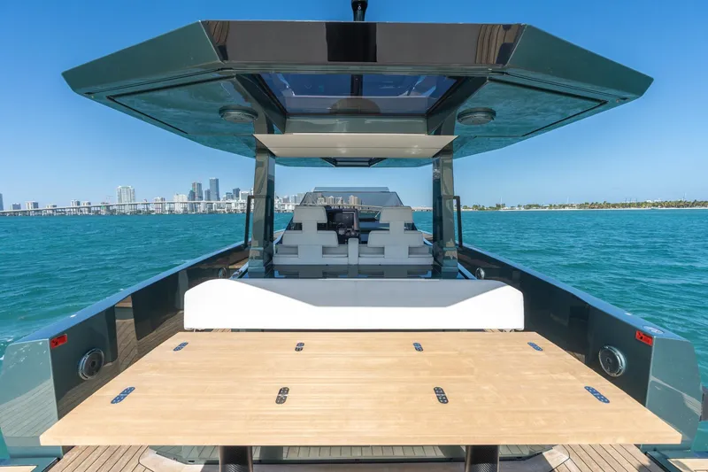 Slide: The Image of 2021 Wally 48 Wally Tender yacht on blue ocean with city skyline backdrop. - 28