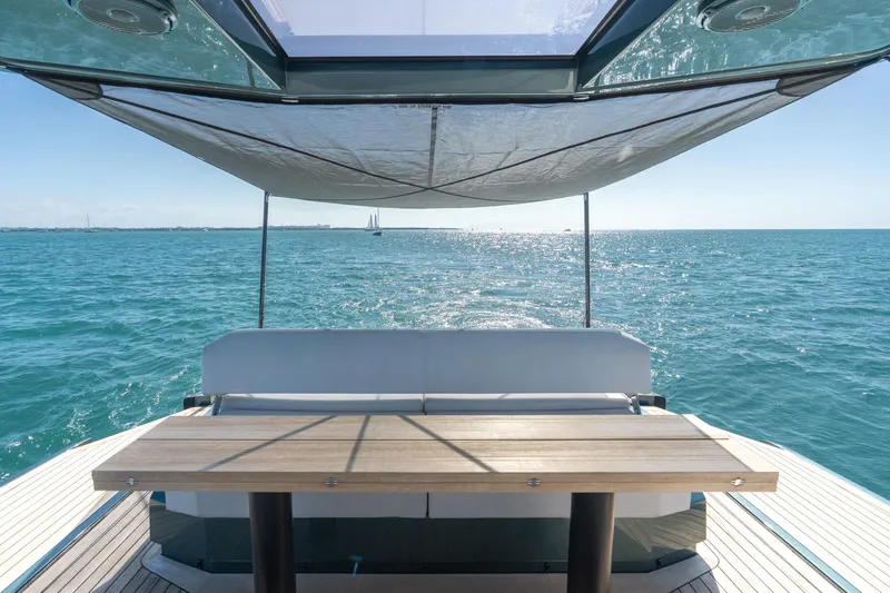 Slide: The Image of 2021 Wally 48 Wally Tender yacht with sunshade, table, and ocean view. - 31