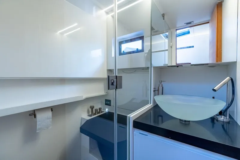 Slide: The Image of Modern bathroom interior on 2021 Wally 48 Wally Tender yacht, featuring sleek design and glass sink. - 45