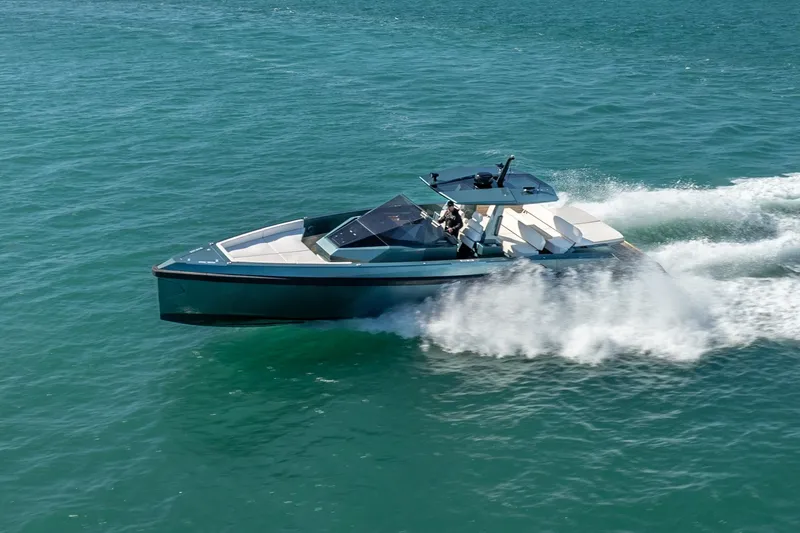 Slide: The Image of 2021 Wally 48 Wally Tender cruising on open water, showcasing sleek design and performance. - 14