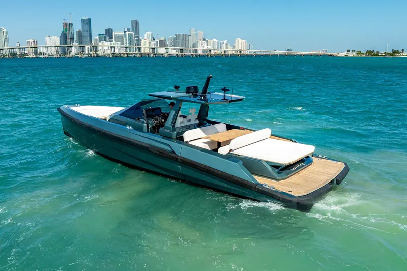 Slide: The Image of 2021 Wally 48 Wally Tender yacht cruising in turquoise waters near a city skyline. - 20