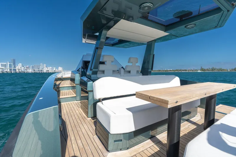 Slide: The Image of 2021 Wally 48 Wally Tender yacht with sleek design, wooden deck, and modern seating. - 23