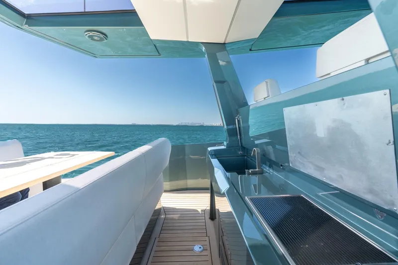 Slide: The Image of 2021 Wally 48 Wally Tender yacht interior with ocean view, featuring sleek design and modern amenities. - 29