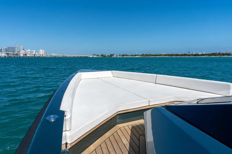 Slide: The Image of 2021 Wally 48 Wally Tender yacht cruising on blue ocean near city skyline. - 34