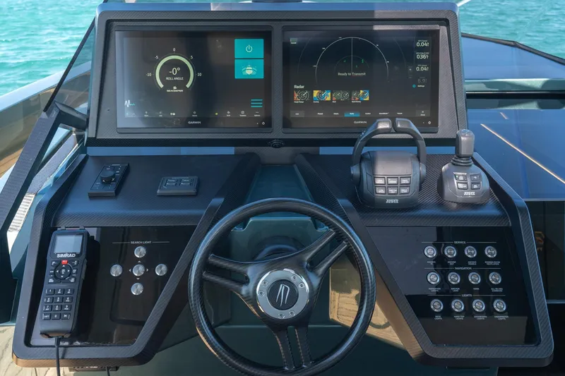 Slide: The Image of 2021 Wally 48 Wally Tender helm with advanced navigation controls and dual displays. - 48
