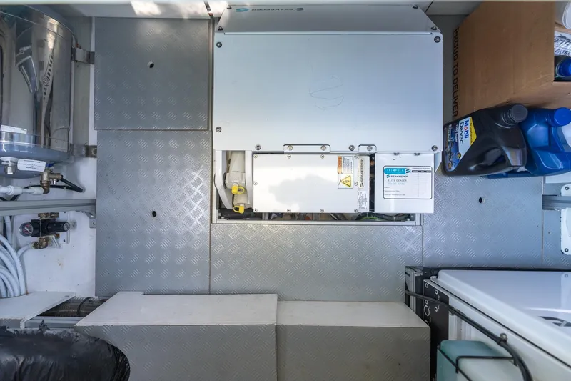 Slide: The Image of Engine compartment of 2021 Wally 48 Wally Tender with maintenance supplies. - 52