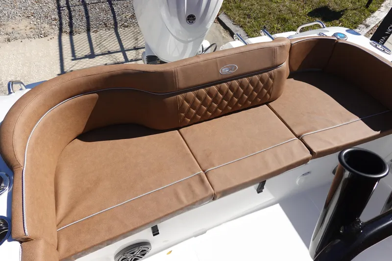 Slide: The Image of 2026 Sea Hunt Ultra 219 boat with brown cushioned seating and elegant design. - 10