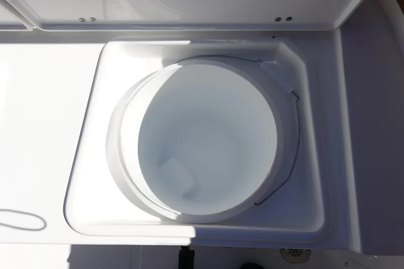 Slide: The Image of Livewell on 2026 Sea Hunt Ultra 219 boat, white interior. - 15