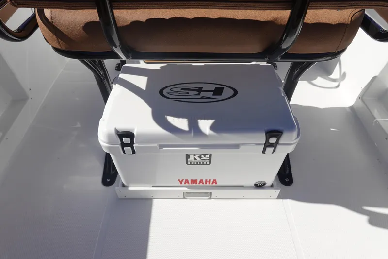 Slide: The Image of 2026 Sea Hunt Ultra 219 boat interior with K2 cooler and Yamaha branding. - 16