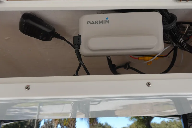 Slide: The Image of Garmin device installed on 2026 Sea Hunt Ultra 219 boat, with visible wiring and microphone. - 26