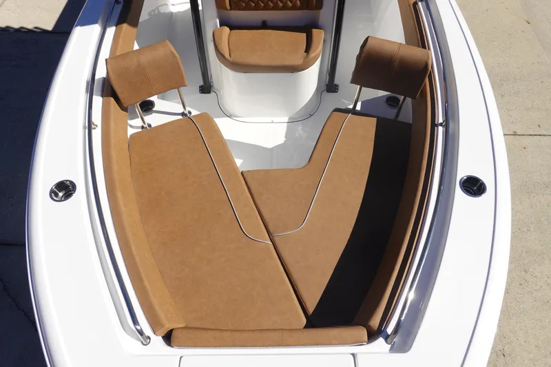Slide: The Image of 2026 Sea Hunt Ultra 219 boat interior with brown cushioned seating. - 30