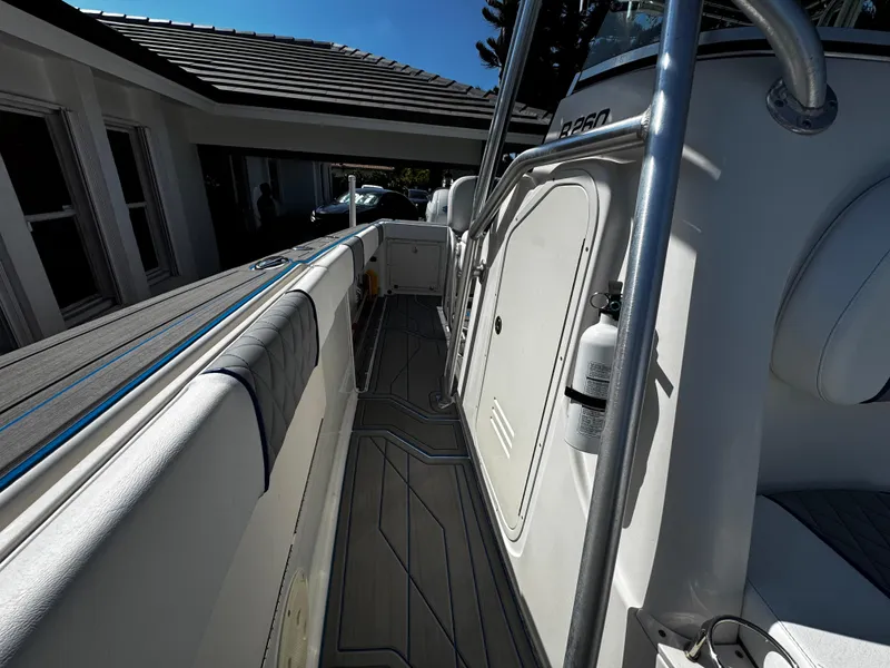 Slide: The Image of 2004 Robalo R 260 boat deck with sleek design and modern features. - 26