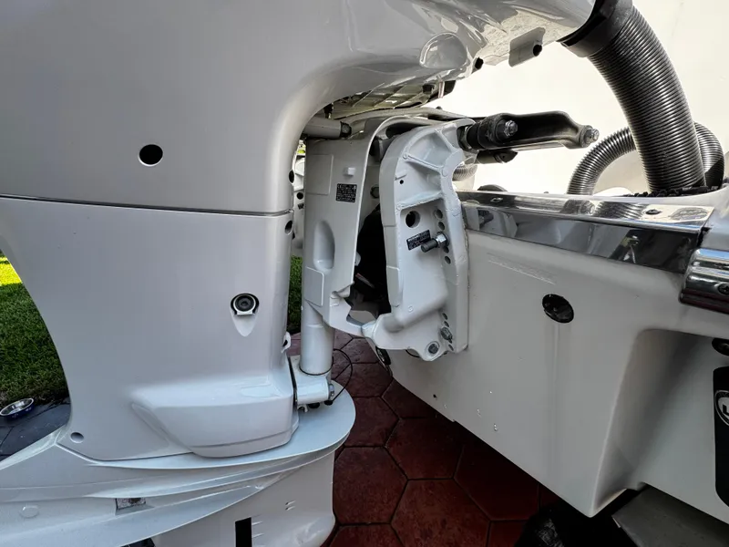 Slide: The Image of 2004 Robalo R 260 boat engine close-up, showcasing motor details and components. - 8