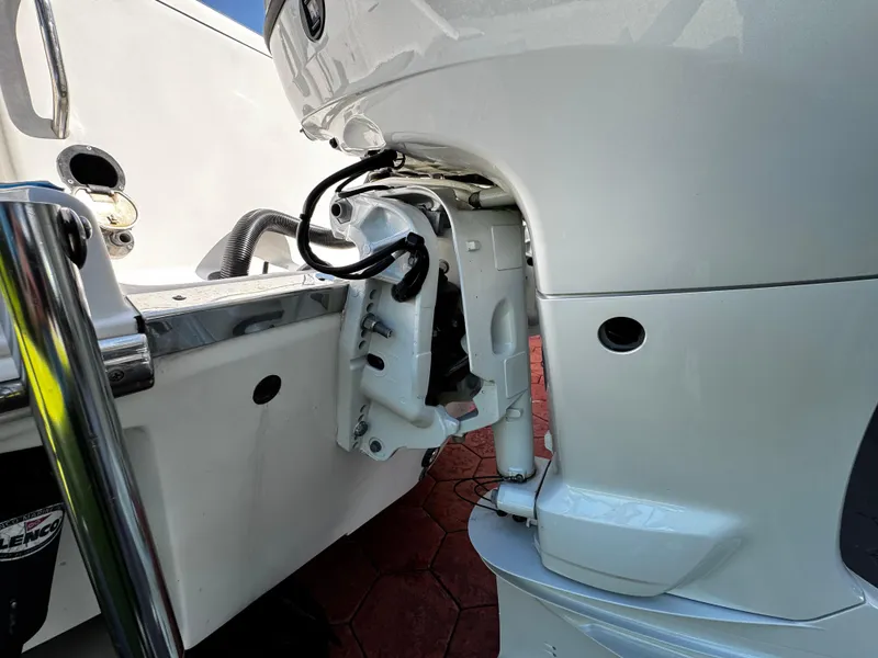 Slide: The Image of 2004 Robalo R 260 boat engine detail, showcasing motor and wiring components. - 9