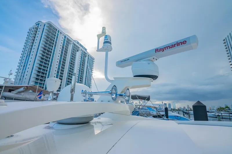 Slide: The Image of 2018 Sea Ray L590 yacht with Raymarine radar, docked near high-rise buildings. - 10