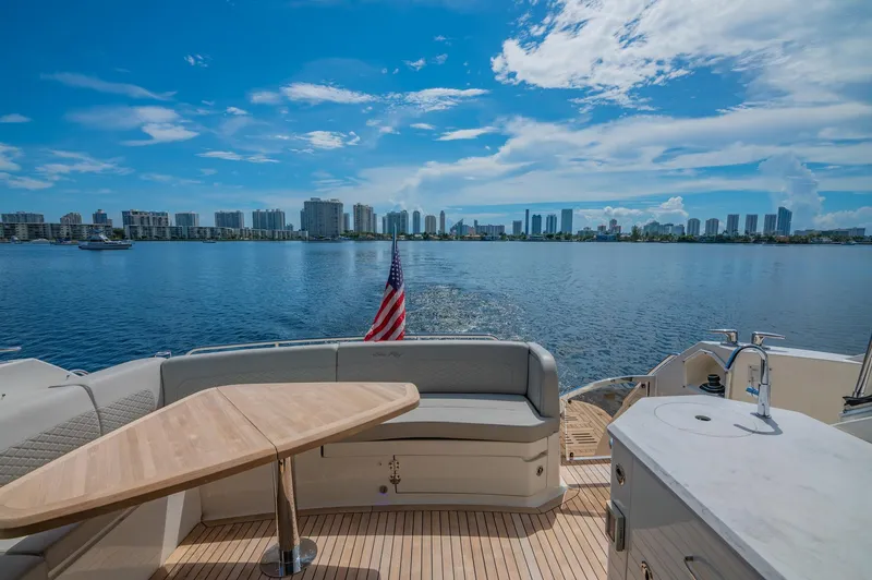 Slide: The Image of 2018 Sea Ray L590 yacht deck with city skyline view. - 16