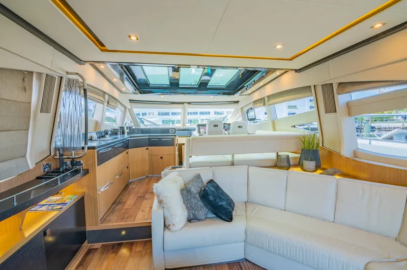 Slide: The Image of Luxurious interior of 2018 Sea Ray L590 yacht with modern furnishings and panoramic windows. - 24