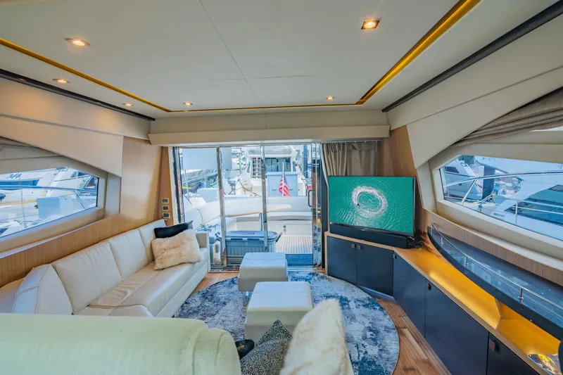 Slide: The Image of Luxurious interior of 2018 Sea Ray L590 yacht with modern furnishings and large windows. - 26