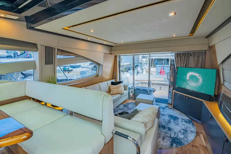 Slide: The Image of Luxurious interior of 2018 Sea Ray L590 yacht with modern furnishings and large windows. - 27