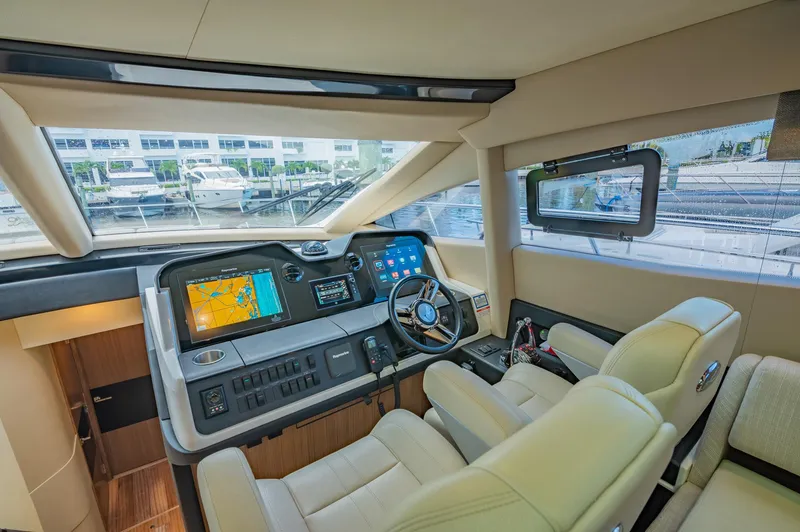 Slide: The Image of 2018 Sea Ray L590 yacht helm with advanced navigation systems and luxurious seating. - 31