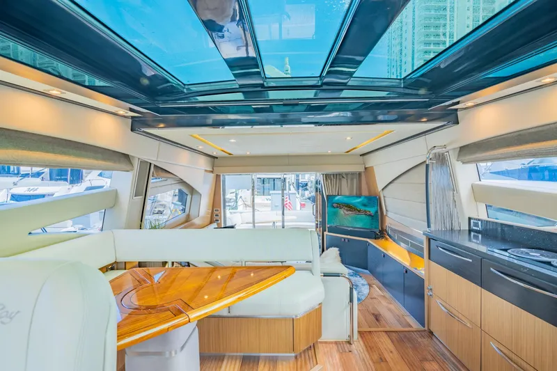 Slide: The Image of Luxurious interior of 2018 Sea Ray L590 yacht with panoramic windows and modern furnishings. - 35