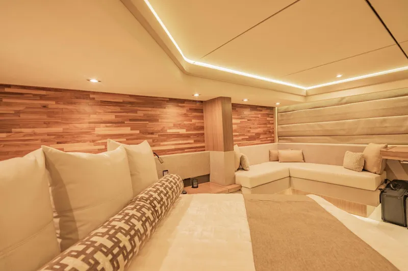 Slide: The Image of Luxurious interior of 2018 Sea Ray L590 yacht with modern wood paneling and plush seating. - 39