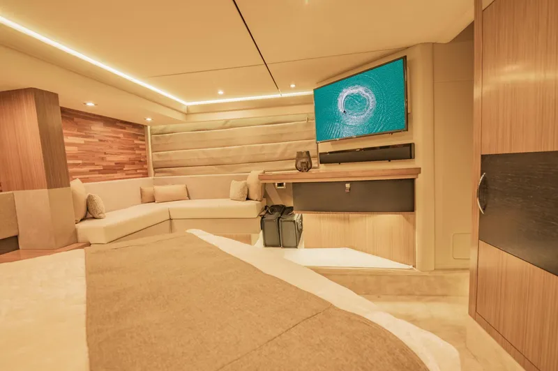 Slide: The Image of Luxurious interior of 2018 Sea Ray L590 yacht with modern furnishings and flat-screen TV. - 40