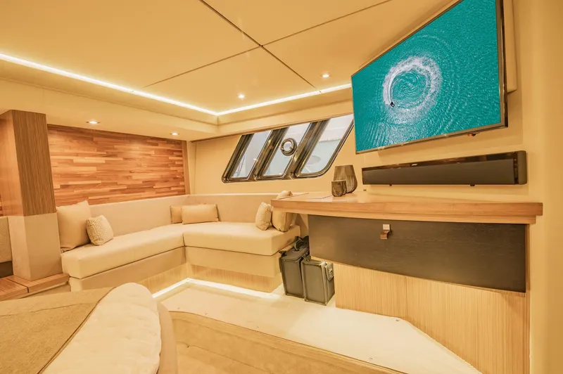Slide: The Image of Luxurious interior of 2018 Sea Ray L590 yacht with modern seating and large TV. - 41