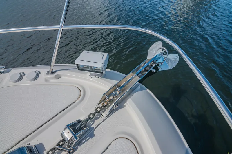 Slide: The Image of 2018 Sea Ray L590 yacht anchor and bow detail on water. - 8