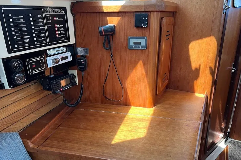 Slide: The Image of Control panel and equipment inside a 1995 Hunter 336 sailboat cabin. - 17