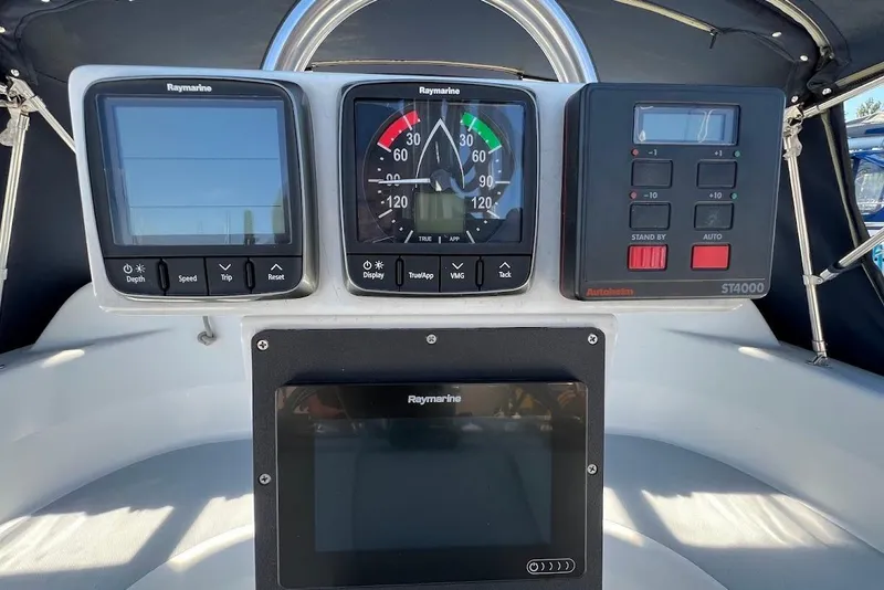 Slide: The Image of Control panel of a 1995 Hunter 336 sailboat with Raymarine instruments. - 28