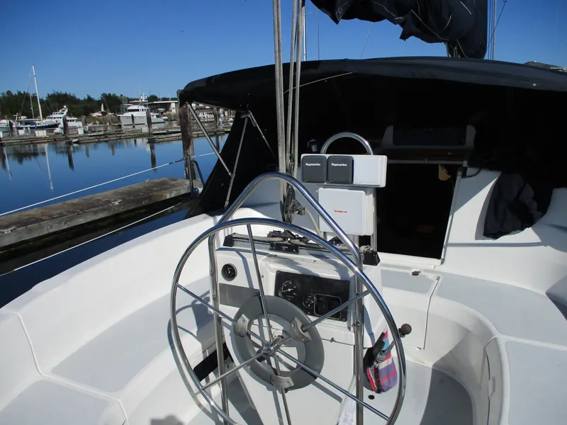 Slide: The Image of Cockpit of a 1995 Hunter 336 sailboat in harbor. - 6