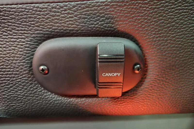 Slide: The Image of AquaPatio 235 DFL 2026 canopy switch on textured panel. - 22