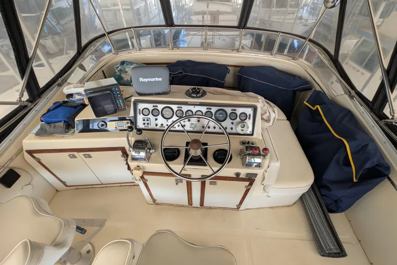 Slide: The Image of 1984 Chris-Craft 382 Commander helm with navigation equipment and classic steering wheel. - 10