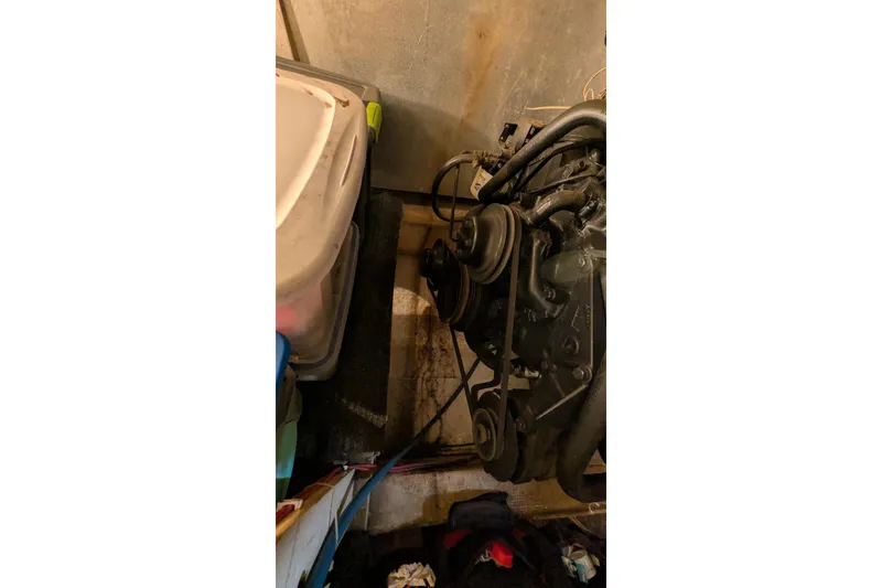 Slide: The Image of 1984 Chris-Craft 382 Commander engine compartment with visible mechanical components. - 100