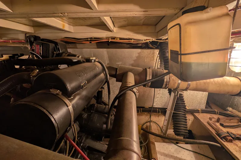 Slide: The Image of Engine room of 1984 Chris-Craft 382 Commander with visible components and wiring. - 103