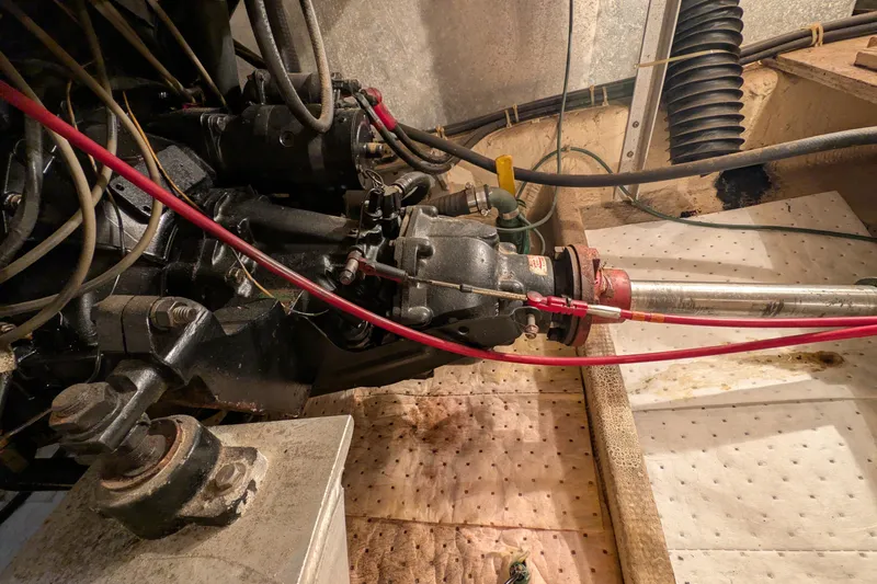 Slide: The Image of Engine compartment of 1984 Chris-Craft 382 Commander with visible mechanical components. - 104