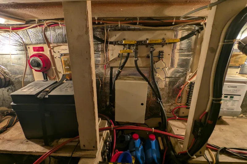 Slide: The Image of 1984 Chris-Craft 382 Commander engine room with wiring, battery, and equipment. - 106