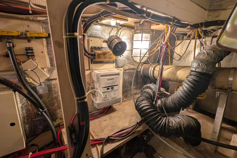 Slide: The Image of Engine room of 1984 Chris-Craft 382 Commander with wiring and ventilation systems. - 107