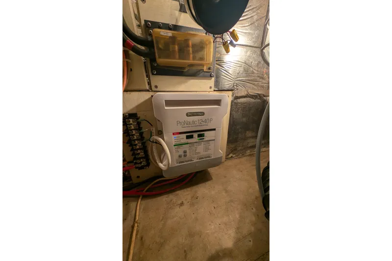 Slide: The Image of Electrical panel and ProNautic charger in 1984 Chris-Craft 382 Commander boat. - 108