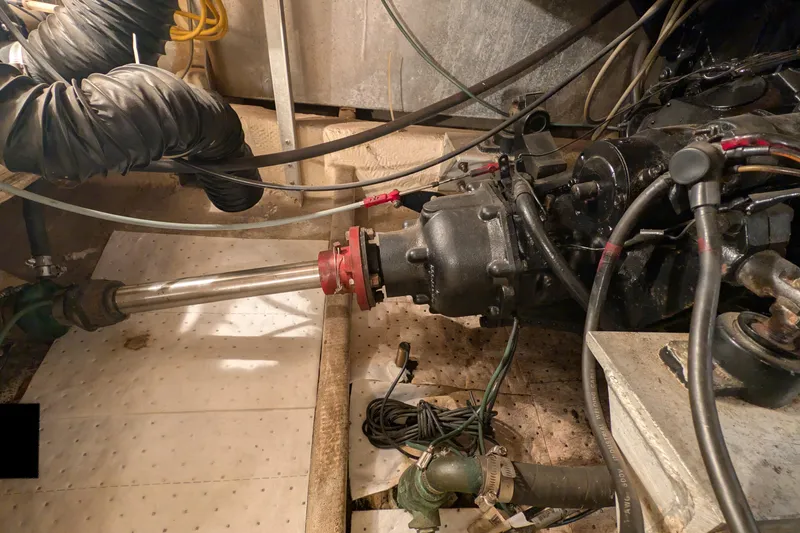 Slide: The Image of Engine room of 1984 Chris-Craft 382 Commander with visible mechanical components and wiring. - 110