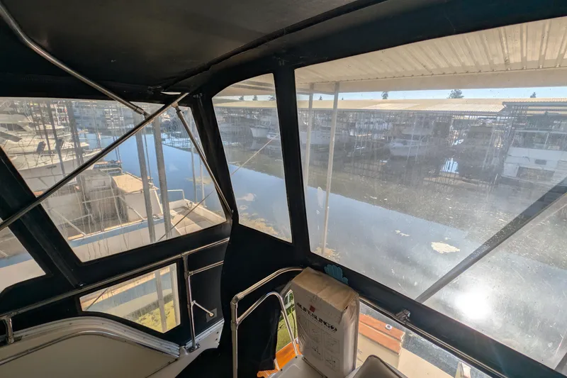 Slide: The Image of Interior view from 1984 Chris-Craft 382 Commander, overlooking marina through windows. - 14