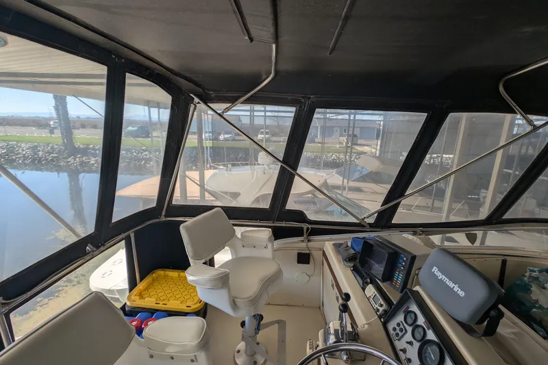 Slide: The Image of Interior view of 1984 Chris-Craft 382 Commander boat cockpit with navigation equipment. - 16