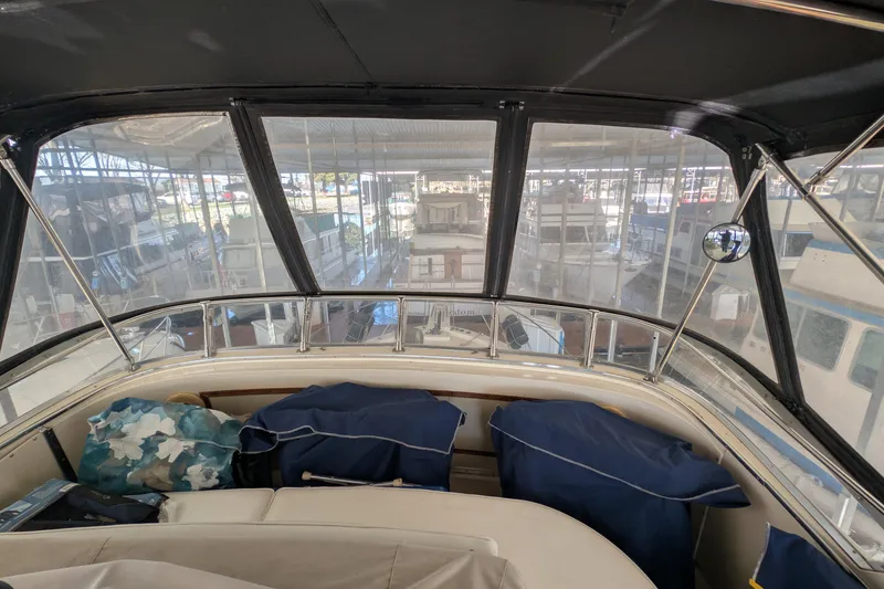Slide: The Image of 1984 Chris-Craft 382 Commander interior view with marina backdrop. - 18