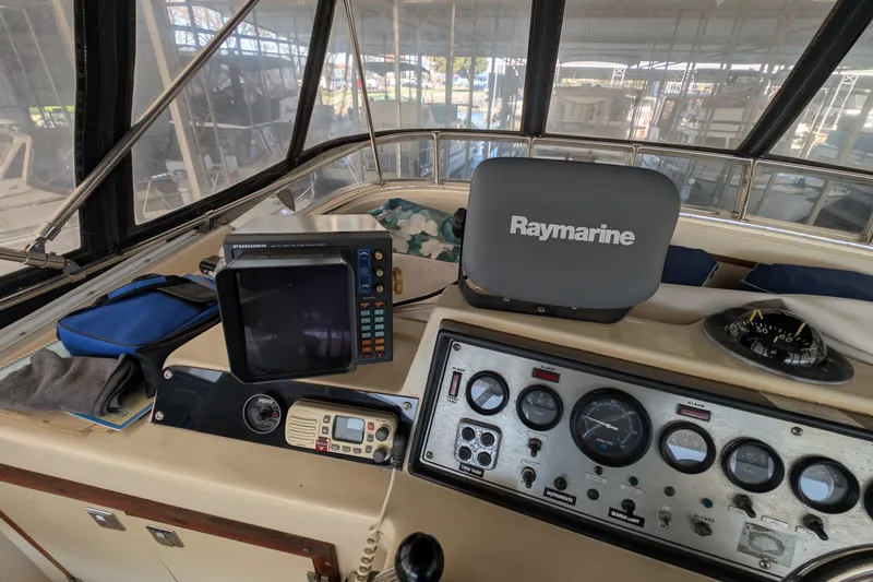 Slide: The Image of 1984 Chris-Craft 382 Commander helm with navigation equipment and gauges. - 20