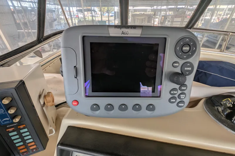 Slide: The Image of Raymarine A60 navigation system on 1984 Chris-Craft 382 Commander yacht dashboard. - 21