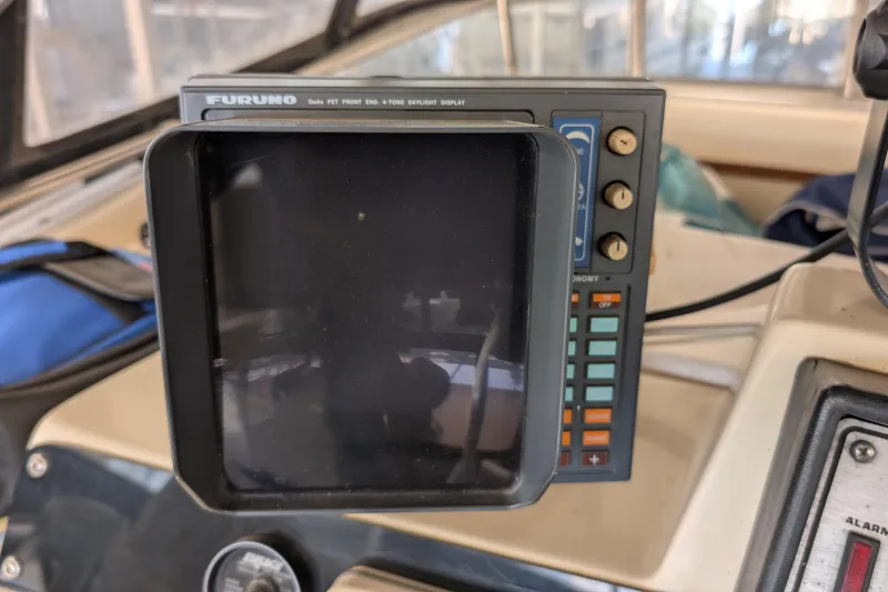 Slide: The Image of Furuno marine radar display on 1984 Chris-Craft 382 Commander boat dashboard. - 22