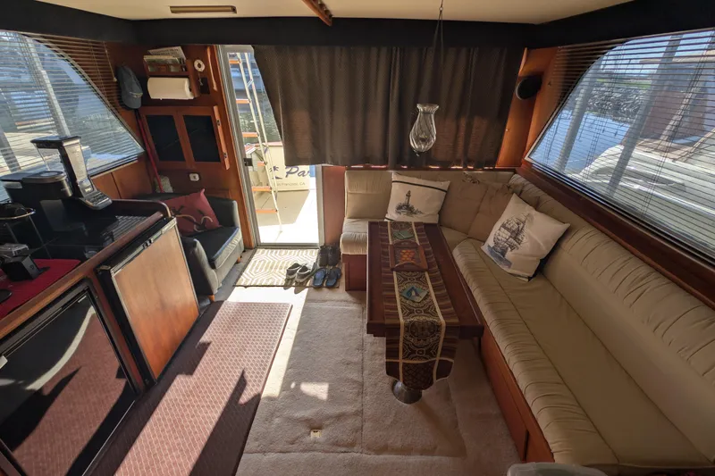 Slide: The Image of Interior of 1984 Chris-Craft 382 Commander yacht with cozy seating and nautical decor. - 29