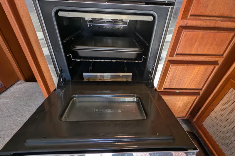 Slide: The Image of Open oven inside 1984 Chris-Craft 382 Commander yacht kitchen. - 42