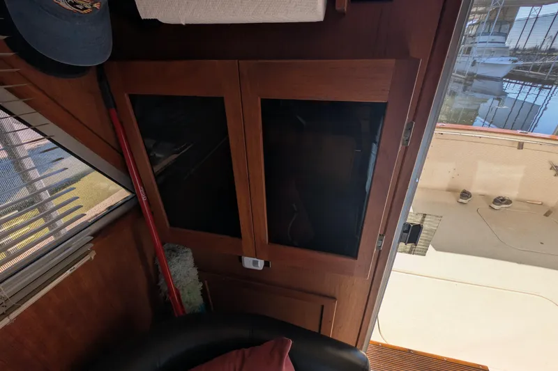 Slide: The Image of Interior view of 1984 Chris-Craft 382 Commander with wooden cabinets and window blinds. - 50
